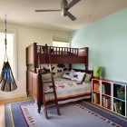 Yet Traditional With Minimalist Yet Traditional Kids Bedroom With Wooden Bunk Bed Blue Carpet Hardwood Floor And Colorful Shelves Kids Room 21 Cool Modern Kids Room With Colorful Furniture Touches