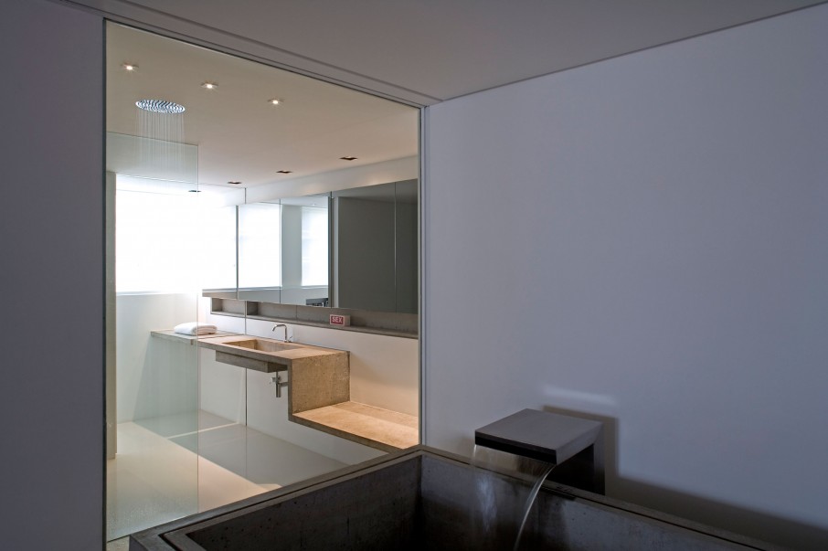 Contemporary Houssein Connected Transparent Contemporary Houssein Apartment Bathtub Connected To Vanity Area Through Wide Glass Window Creating Interesting Interplay Apartments  Fascinating Modern-Industrial Apartment With Beautiful Sophisticated Accent