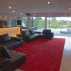 Spacious Maribyrnong Room Ultra Spacious Maribyrnong House Living Room Integrating A Large Red Carpet As A Focal Point Of The Room Architecture Lavish And Breathtaking Contemporary Home With Spectacular Exterior Appearance