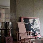 Lazy Chair Dark Unique Lazy Chair Standing On Dark Wood Floor Of Contemporary Houssein Apartment Decorated With Artwork Leaning On Wall Behind Apartments Fascinating Modern-Industrial Apartment With Beautiful Sophisticated Accent