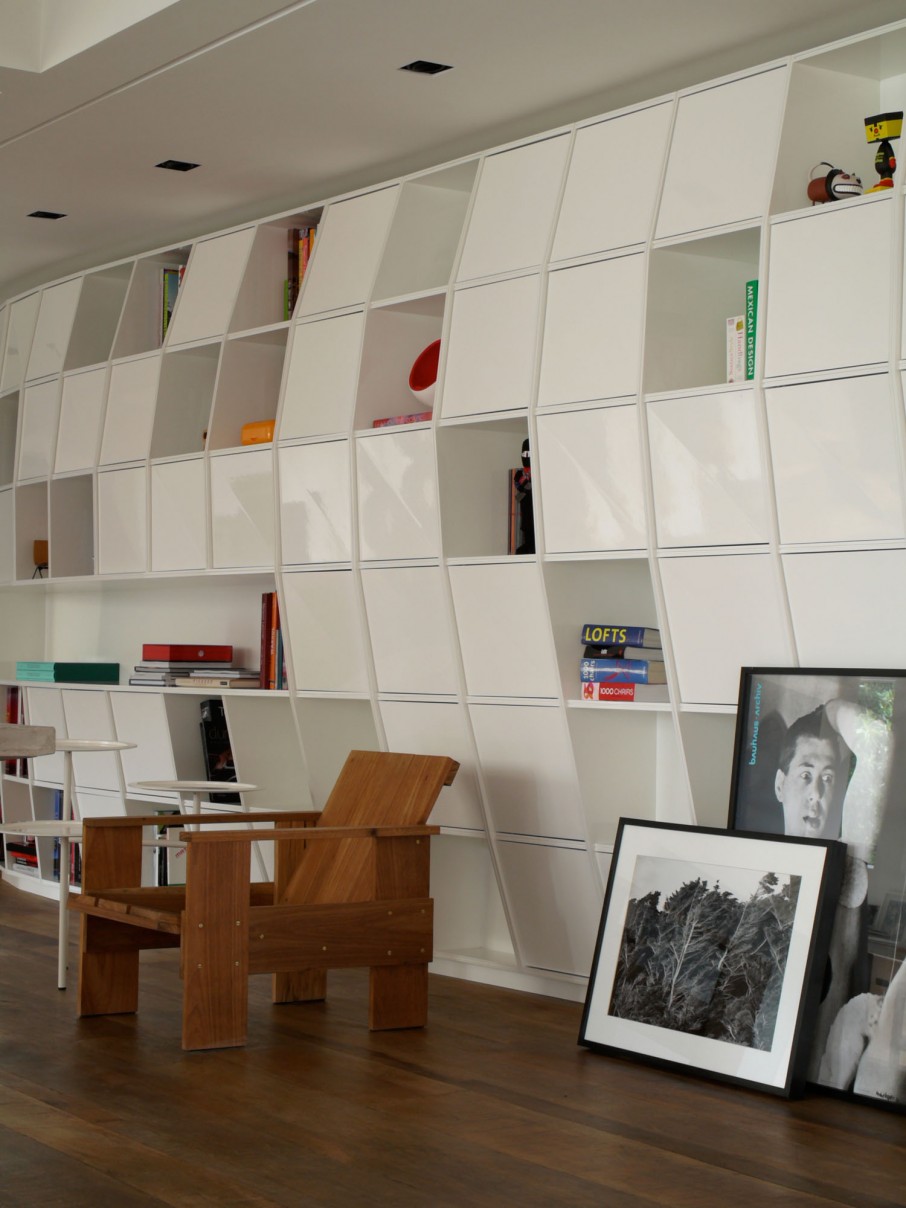 Wooden Armchair White Unusual Wooden Armchair Combined With White Rounded Side Table And Sleek Bookcase Behind Decorated With Photo And Artwork Apartments  Fascinating Modern-Industrial Apartment With Beautiful Sophisticated Accent