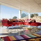 Living Room Shaped Cozy Living Room With L Shaped Red Sofa Many Roche Bobois Cushions Unusual Table And Colorful Carpet Dream Homes Stunning And Elegant Living Room With Futuristic Modern Furniture