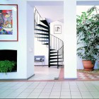 Spiral Staircase Paint Extraordinary Spiral Staircase With Abstract Paint On The White Wall Space Saving Staircase Designs Interior Others Black Metal Space Decoration Visualize Staircase Designs For Classy Center Of Awesome Interiors