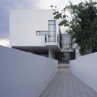 Link Bridge Concrete Attractive Link Bridge Designed With Concrete Railing And Tile Flooring To Access House PS The Heder Partnership Architecture Stunning Modern Home With Unique Curved Walls And Comfortable Pools