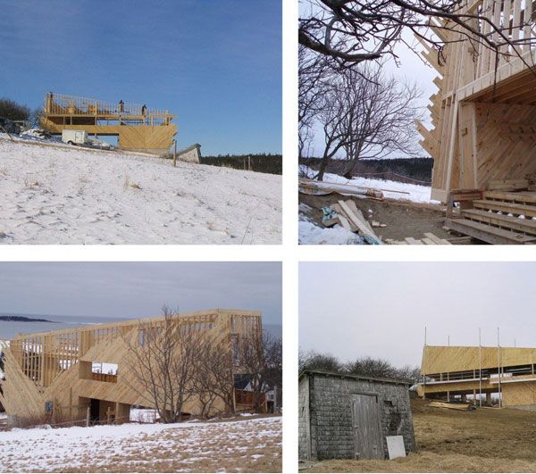 Sliding House Construction Awesome Sliding House In Canada Construction View Displaying Sandy Ground With Dried Plantation Surrounding The Home Architecture Warm Minimalist Cabin With Black Furniture And Modern Fireplace