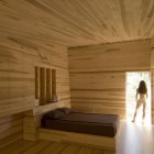 Sliding House Bedroom Nice Sliding House In Canada Bedroom Suite With Hidden Wardrobe On Wooden Wall Installed Next To Platform Bed Architecture Warm Minimalist Cabin With Black Furniture And Modern Fireplace