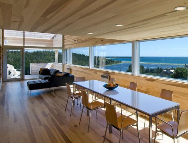 Sliding House Living Open Sliding House In Canada Living Room And Dining Space Interior With Transparency Overlooking Ocean View Architecture Warm Minimalist Cabin With Black Furniture And Modern Fireplace