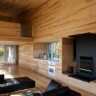 Sliding House Unitary Stylish Sliding House In Canada Unitary Room Interior Designed With Black Unit Of Fireplace TV Stand And Furnishing Architecture Warm Minimalist Cabin With Black Furniture And Modern Fireplace