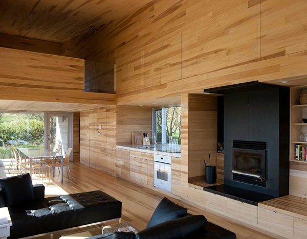 Sliding House Unitary Stylish Sliding House In Canada Unitary Room Interior Designed With Black Unit Of Fireplace TV Stand And Furnishing Architecture  Warm Minimalist Cabin With Black Furniture And Modern Fireplace